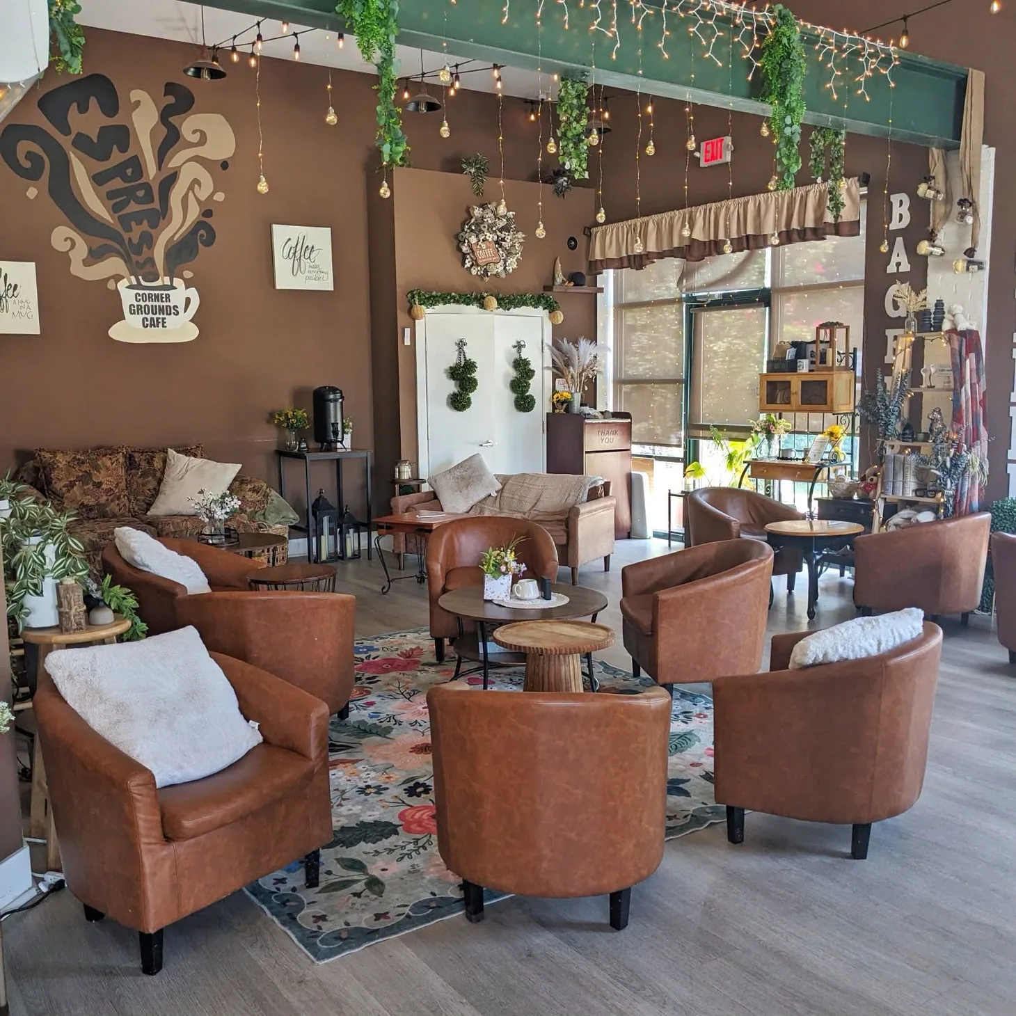 Comfortable seating and warm hanging lights inside Corner Grounds Café